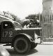 [Un vecchio camion che transita davanti a un monumento, Aix Les Bains (Francia), estate 1952