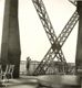 [Albertino, dal primo piano della Tour Eiffel, punta l'occhio acutissimo della sua cassetta fotografica verso il cielo, Parigi, estate 1952